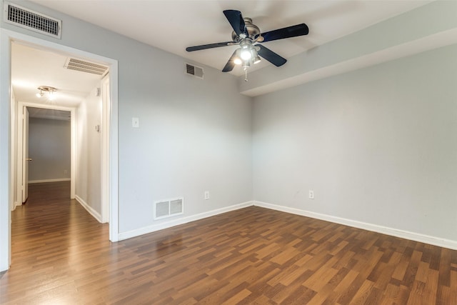 unfurnished room with visible vents and wood finished floors