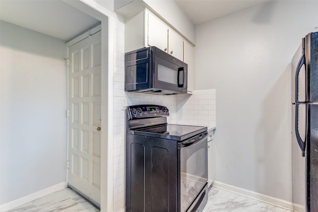 kitchen with baseboards, black appliances, marble finish floor, white cabinetry, and tasteful backsplash