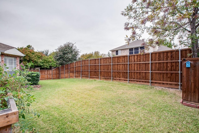 view of yard featuring a fenced backyard