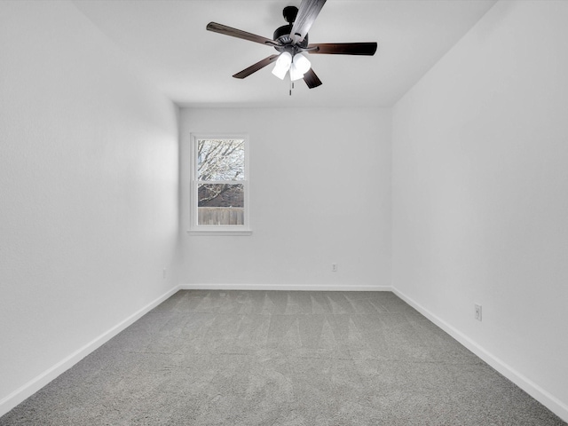 unfurnished room with baseboards, carpet, and ceiling fan