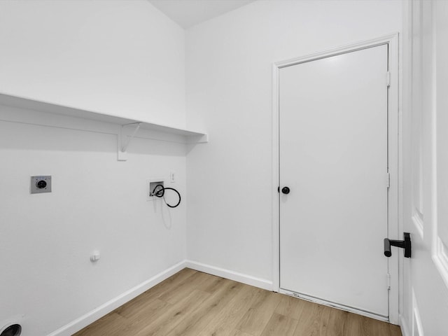 washroom with baseboards, light wood-type flooring, washer hookup, laundry area, and electric dryer hookup