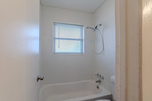 full bathroom featuring tub / shower combination and toilet