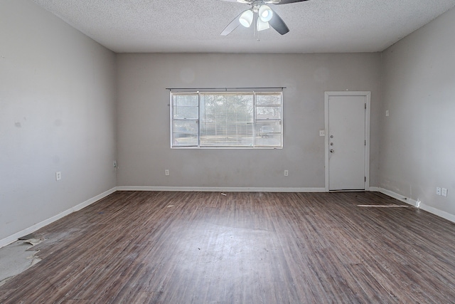 empty room featuring a textured ceiling, a ceiling fan, baseboards, and wood finished floors