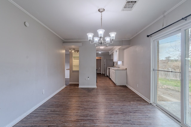 unfurnished dining area with dark wood-style floors, a sink, baseboards, and ornamental molding