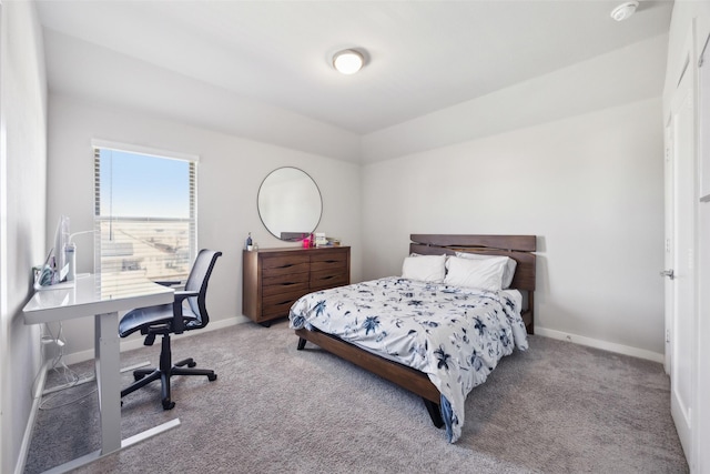 carpeted bedroom with baseboards