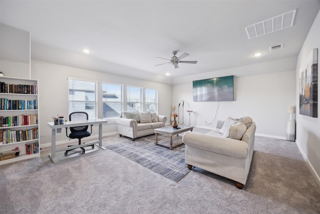 living area with recessed lighting, visible vents, and carpet flooring