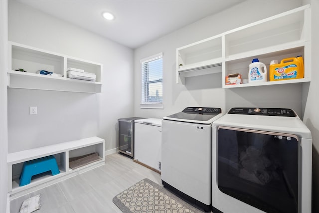 laundry room featuring laundry area, recessed lighting, baseboards, and separate washer and dryer