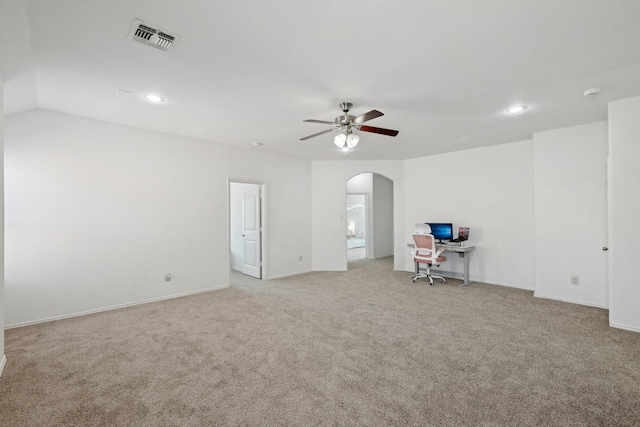 interior space featuring visible vents, ceiling fan, light colored carpet, recessed lighting, and arched walkways