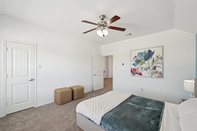 bedroom with visible vents, carpet floors, a ceiling fan, and vaulted ceiling