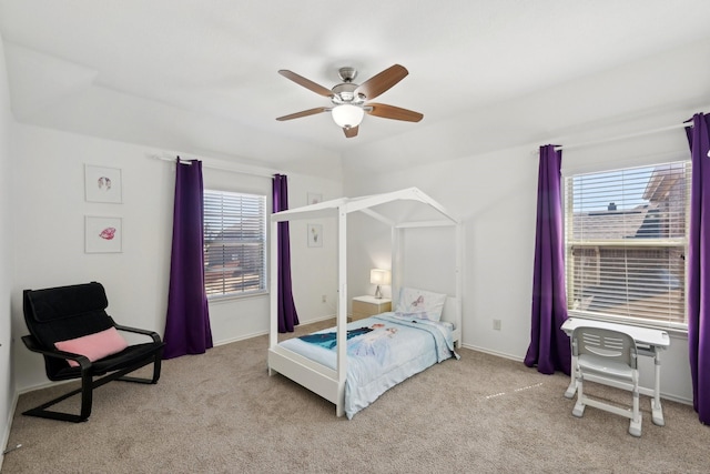 bedroom with multiple windows, carpet, and a ceiling fan