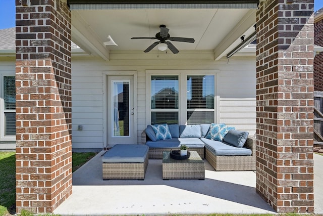 view of patio with an outdoor living space and a ceiling fan