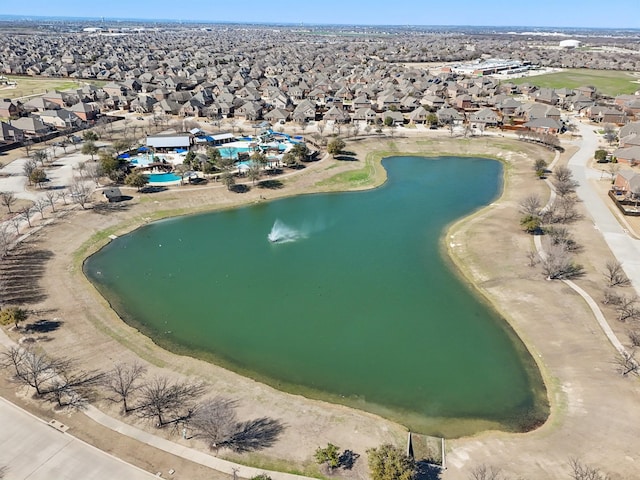 birds eye view of property with a residential view and a water view