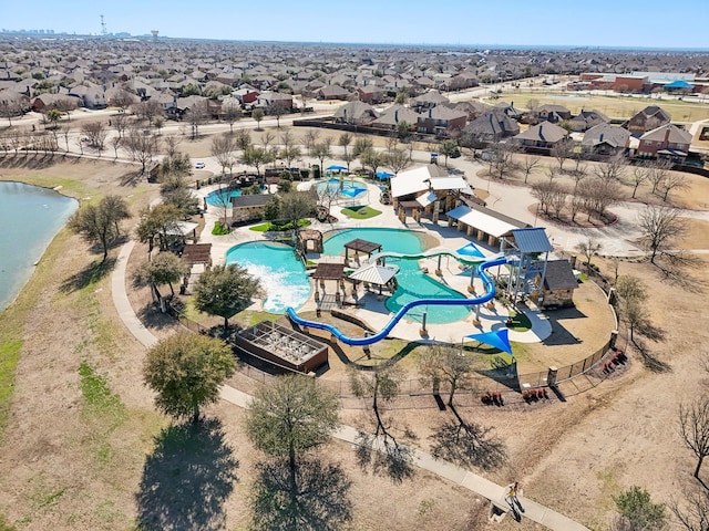 bird's eye view featuring a residential view and a water view