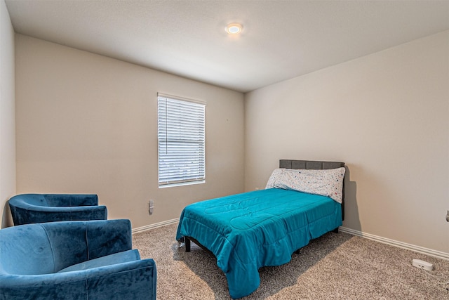 carpeted bedroom with baseboards