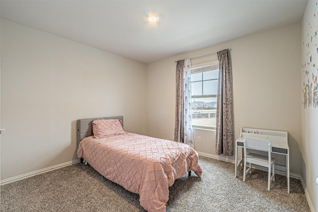 carpeted bedroom with baseboards