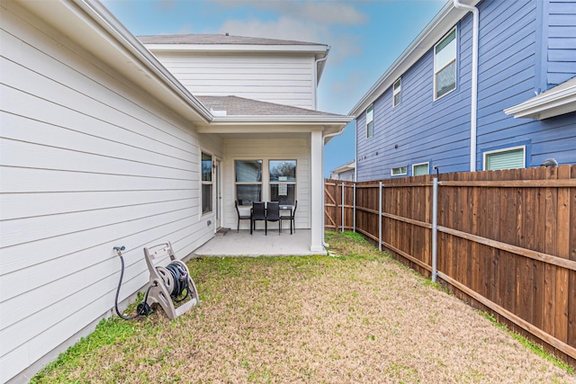 view of yard with a patio area and a fenced backyard