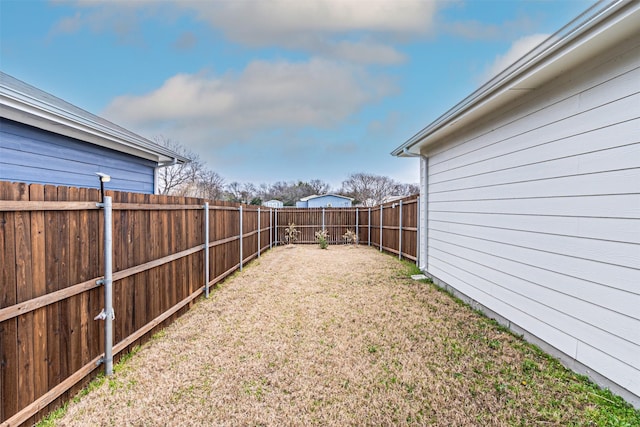 view of yard with a fenced backyard