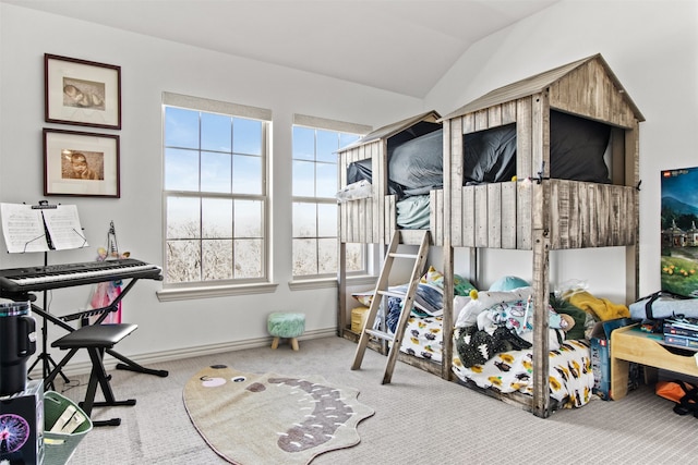 bedroom featuring vaulted ceiling, carpet, and baseboards