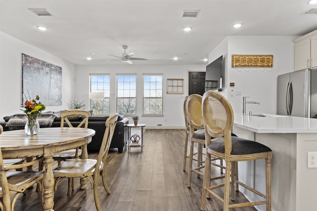 dining space with visible vents, recessed lighting, and light wood-style floors