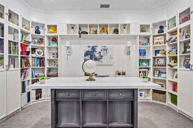 interior space with visible vents, light colored carpet, gray cabinets, and crown molding