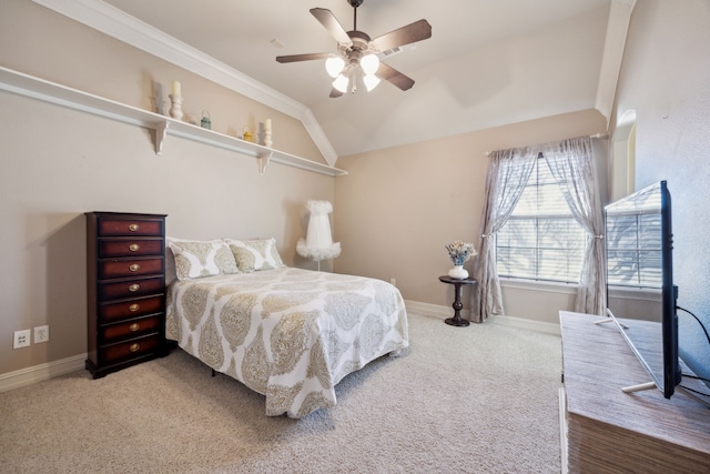 bedroom with carpet flooring, a ceiling fan, baseboards, and vaulted ceiling