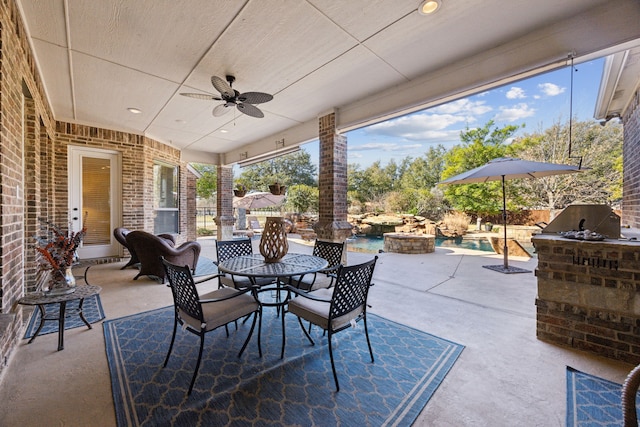 view of patio with a fenced in pool, a fire pit, ceiling fan, outdoor dining space, and area for grilling