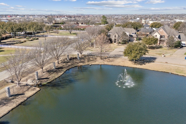 bird's eye view with a residential view and a water view