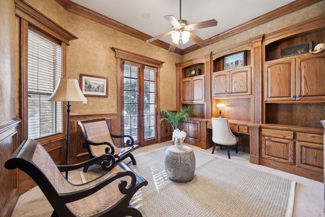 office featuring plenty of natural light, built in study area, crown molding, and a ceiling fan