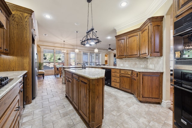 kitchen with a peninsula, ornamental molding, tasteful backsplash, and a sink