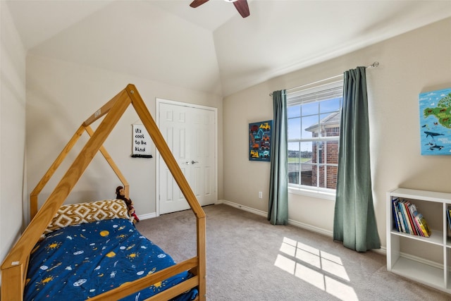 bedroom featuring baseboards, a ceiling fan, carpet, and vaulted ceiling