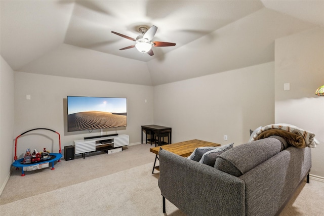 carpeted living room with lofted ceiling, a ceiling fan, and baseboards