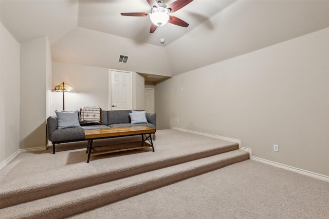 living room featuring visible vents, ceiling fan, baseboards, carpet, and lofted ceiling