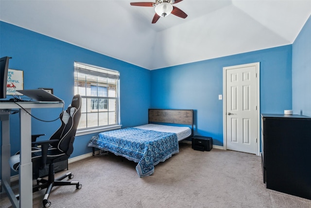 carpeted bedroom with baseboards, ceiling fan, and vaulted ceiling