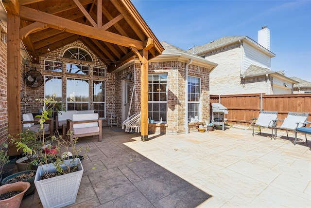 view of patio / terrace featuring fence