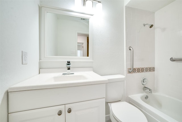 full bath featuring vanity, toilet, shower / bath combination, and a textured wall