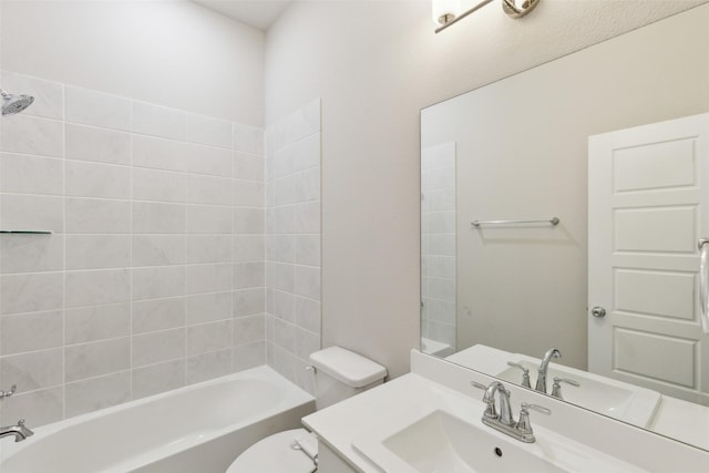 bathroom featuring vanity,  shower combination, and toilet