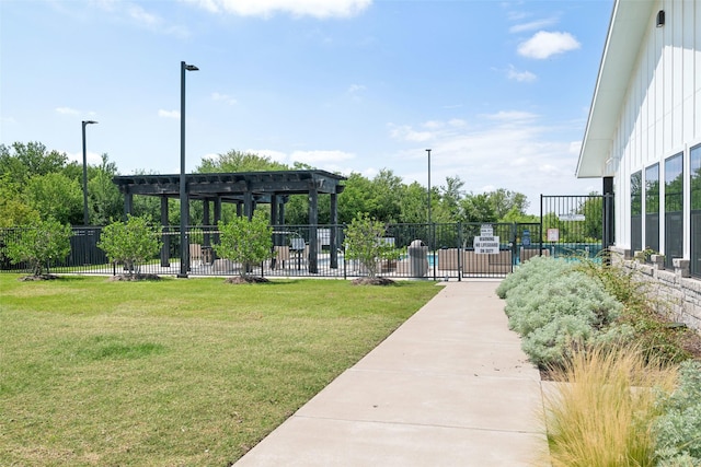 view of home's community featuring a yard, a pergola, and fence