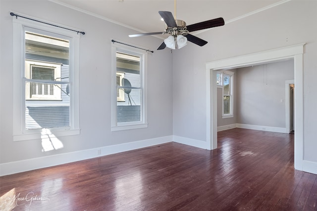 unfurnished room with ceiling fan, crown molding, baseboards, and wood finished floors