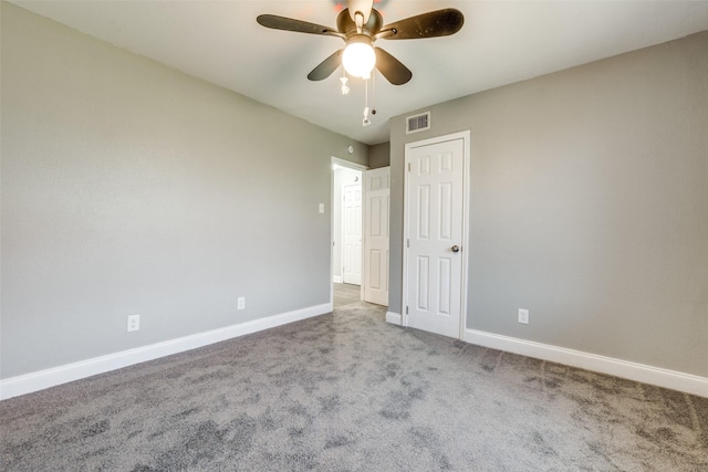 unfurnished bedroom featuring visible vents, ceiling fan, baseboards, carpet floors, and a closet