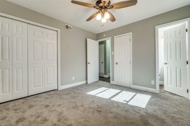 unfurnished bedroom with visible vents, carpet flooring, and baseboards