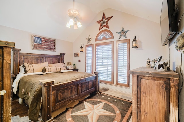 bedroom featuring high vaulted ceiling