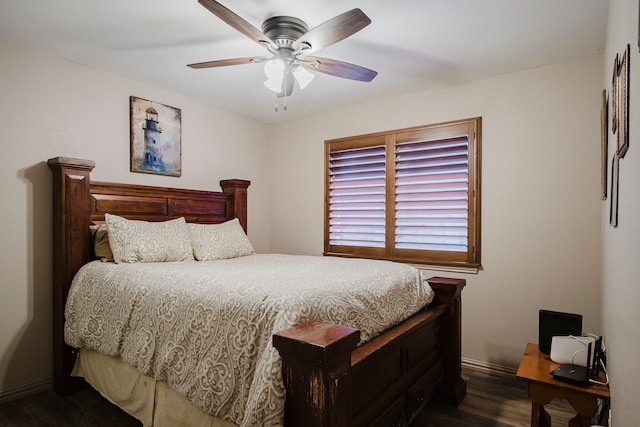 bedroom featuring baseboards, dark wood-type flooring, and ceiling fan