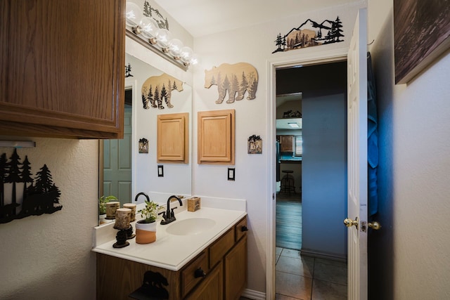 bathroom featuring vanity and tile patterned flooring