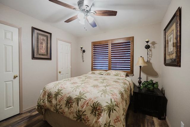 bedroom with baseboards, dark wood-style flooring, and ceiling fan