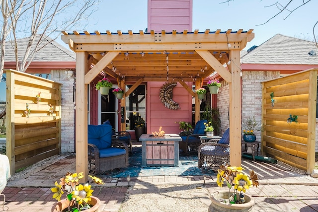 view of patio / terrace featuring an outdoor living space with a fire pit and a pergola