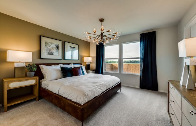 bedroom featuring a notable chandelier, light colored carpet, and baseboards