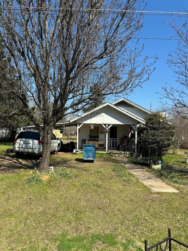 view of yard with covered porch