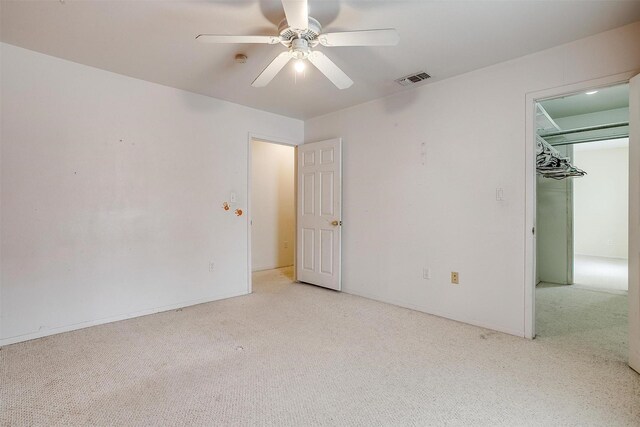 unfurnished bedroom with visible vents, ceiling fan, and carpet flooring