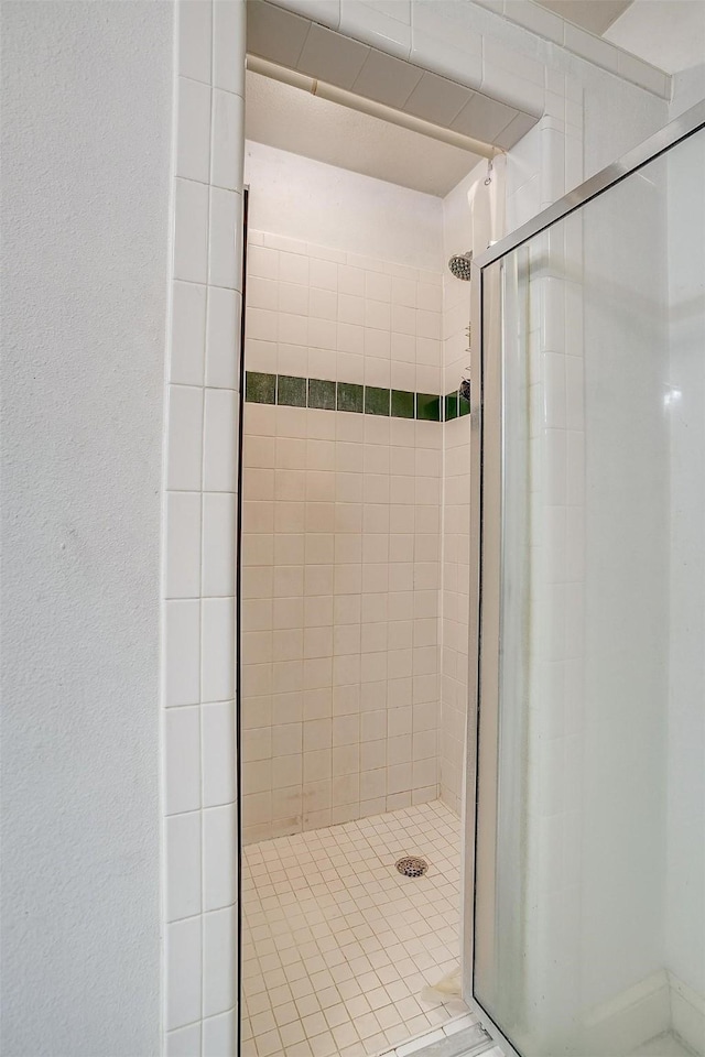 bathroom with a shower stall