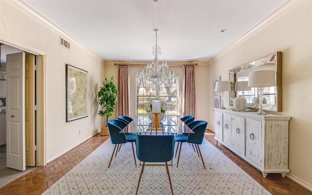 dining area featuring visible vents, baseboards, an inviting chandelier, and crown molding